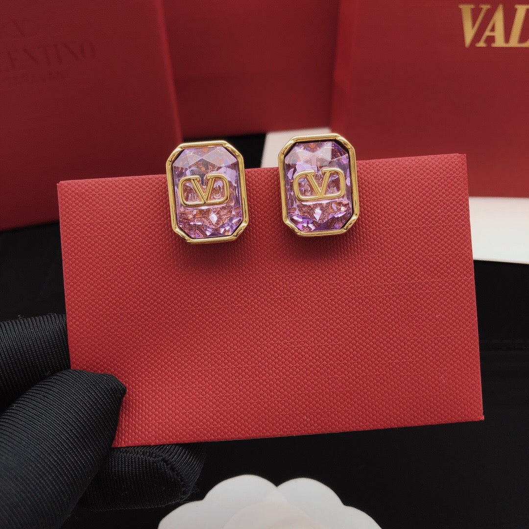 Signature Emblem Crystal-Accent Stud Earrings – Purple front view