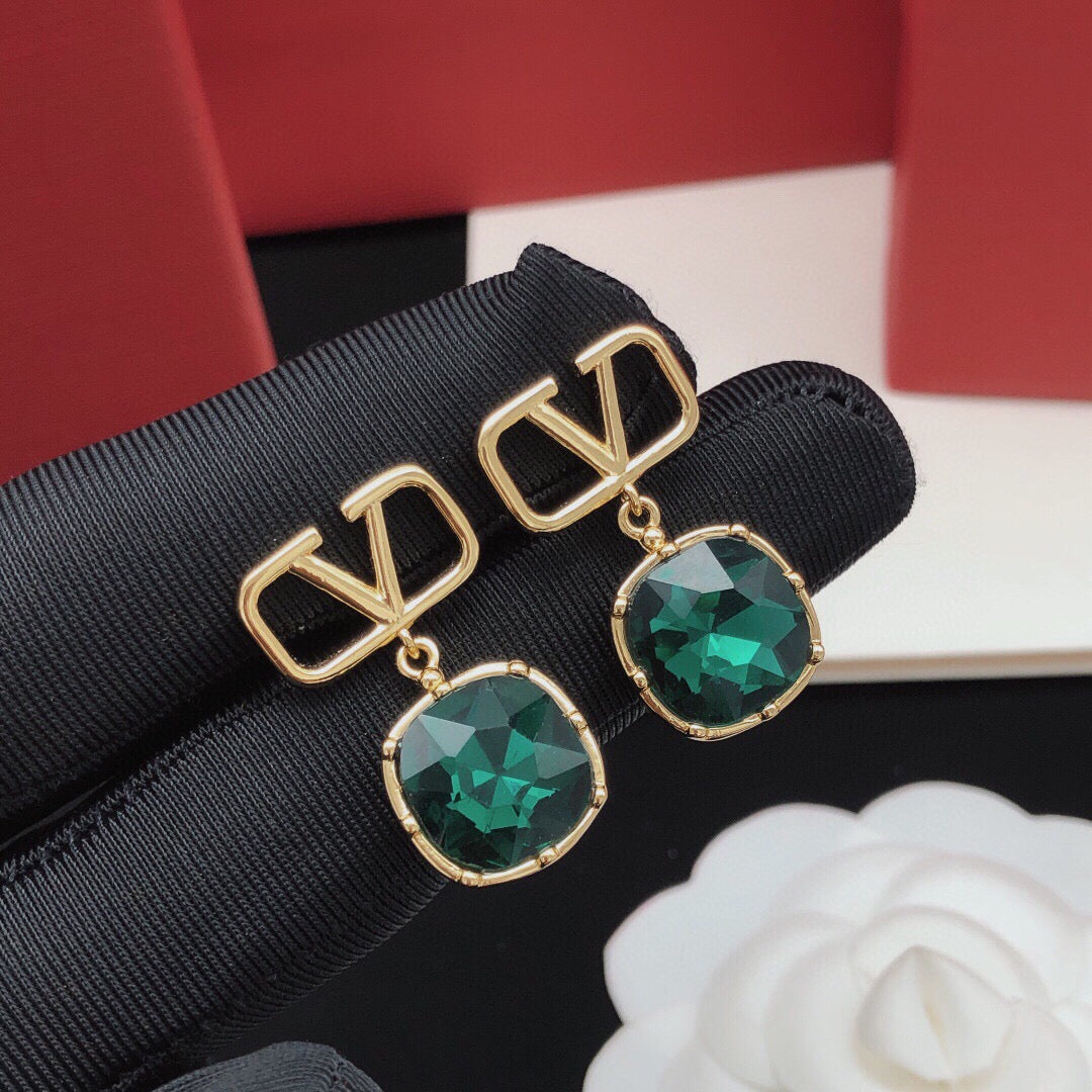 Signature Emblem Crystal-Accent Stud Earrings – Red close-up view