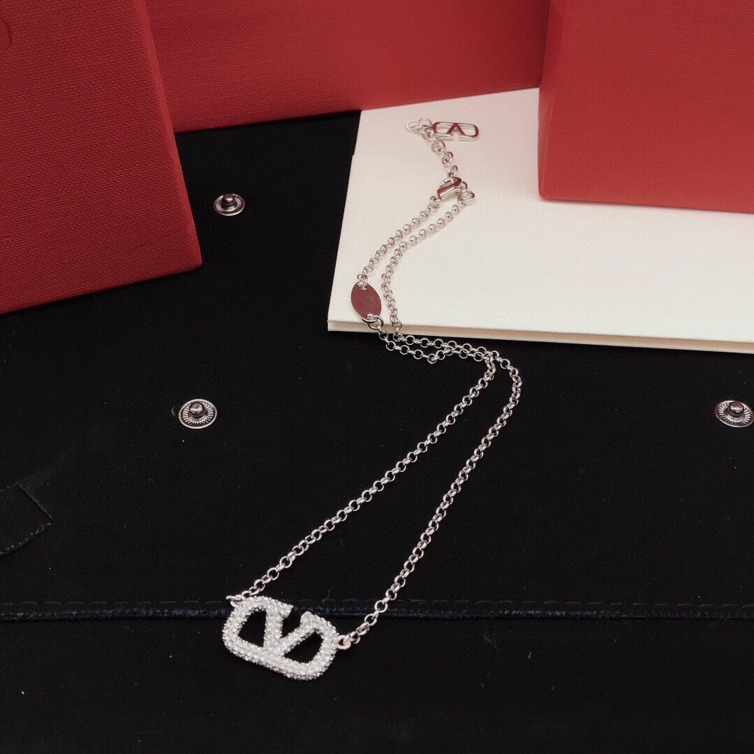 Signature Emblem Crystal-Accent Pendant Necklace – Design 02 close-up view