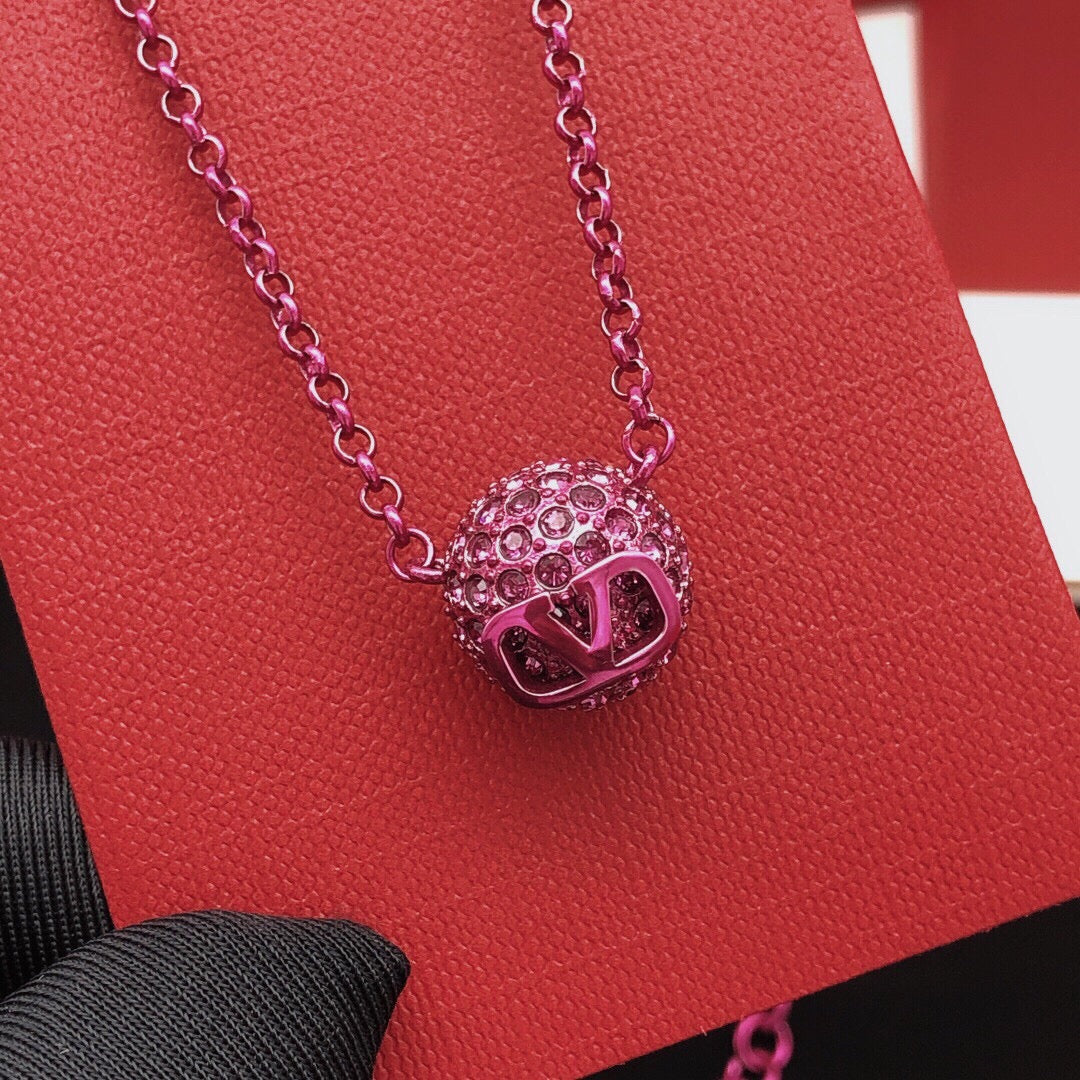 Signature Emblem Crystal-Accent Pendant Necklace – Purple close-up view