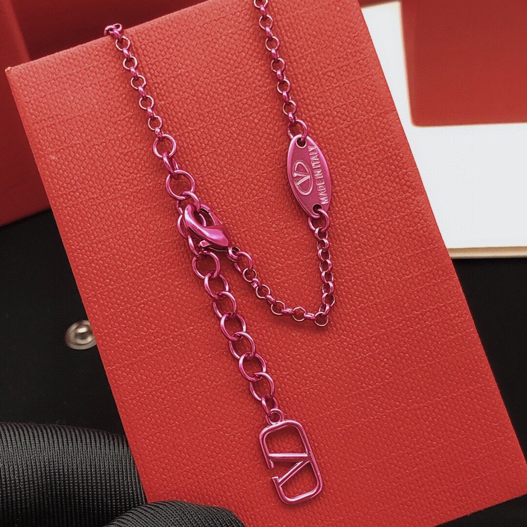 Signature Emblem Crystal-Accent Pendant Necklace – Purple styled detail