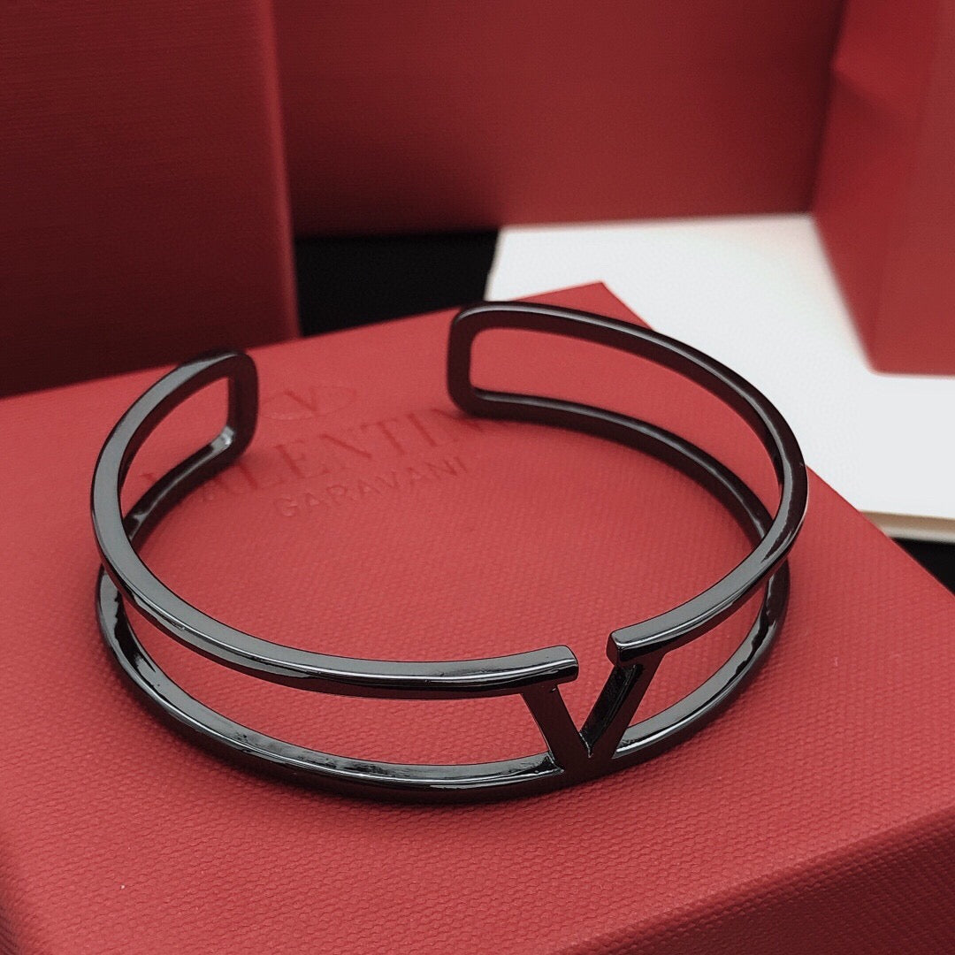 Signature Emblem Cuff Bracelet in Gold-Tone – Black detail view