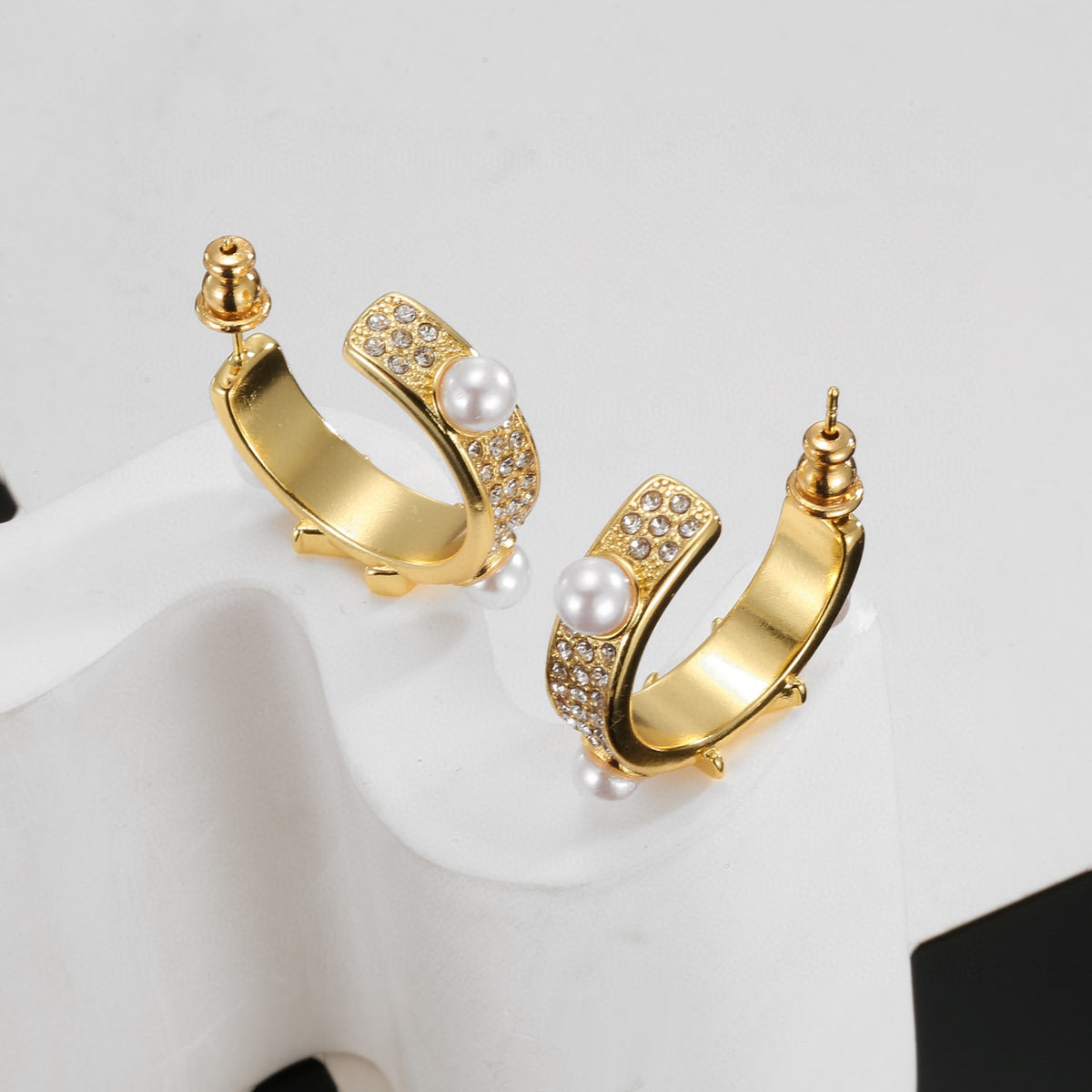 Letter Emblem Stud Earrings in Polished Metal-Tone – Design 028 close-up detail