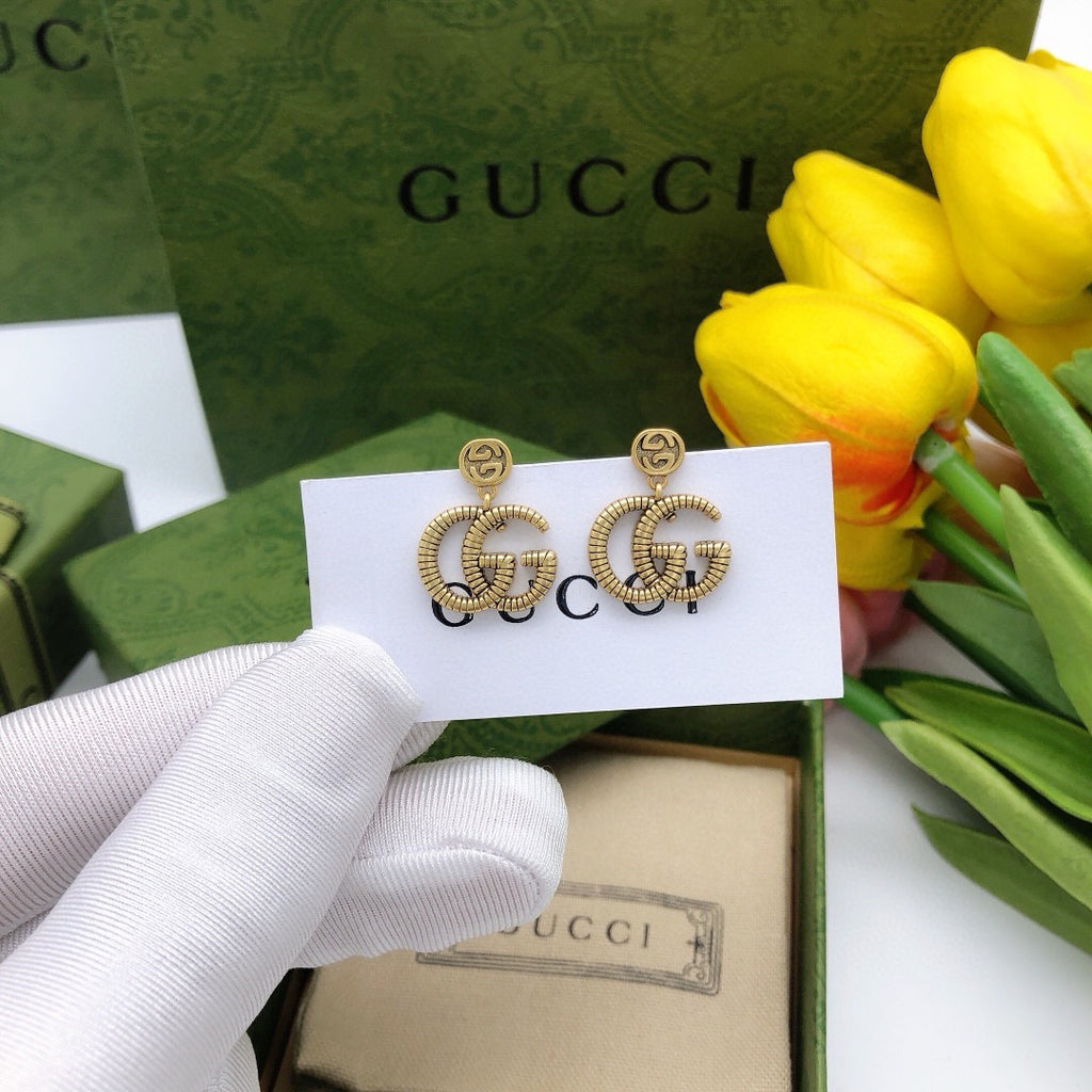 Double-G Emblem Stud Earrings in Polished Metal-Tone – Design 026 styled product view