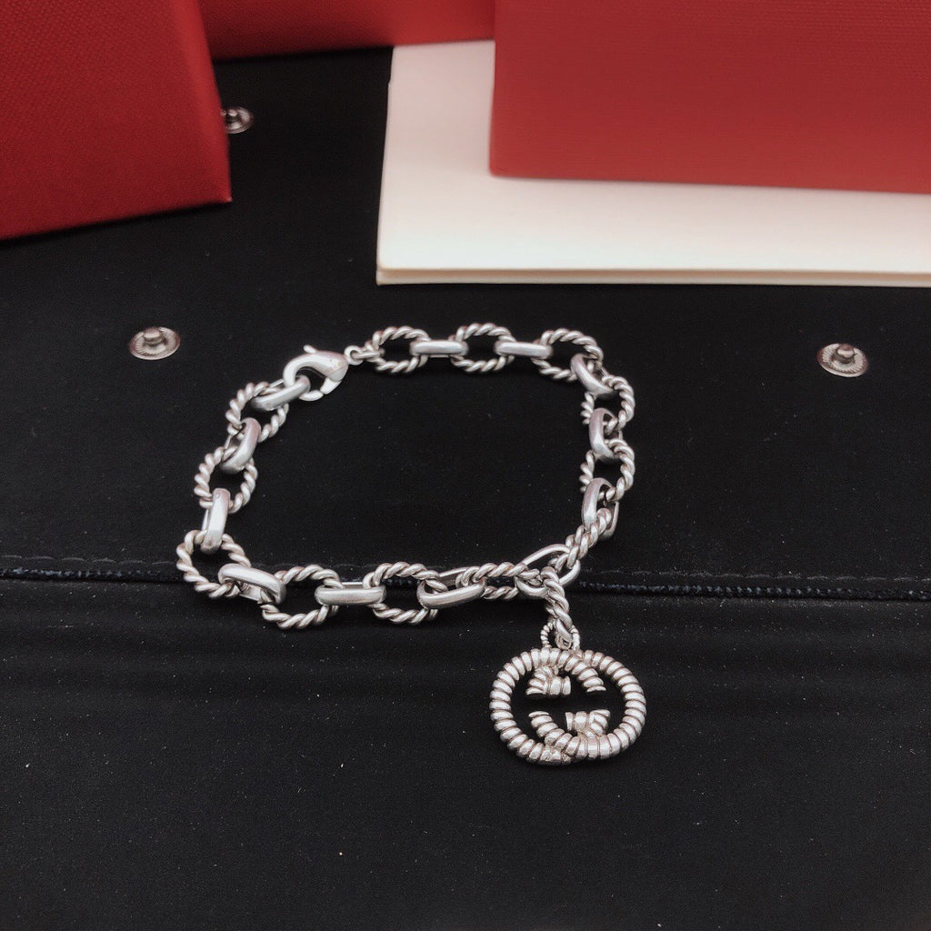 Geometric Emblem Bracelet in Silver-Tone – Vintage Detail front product view