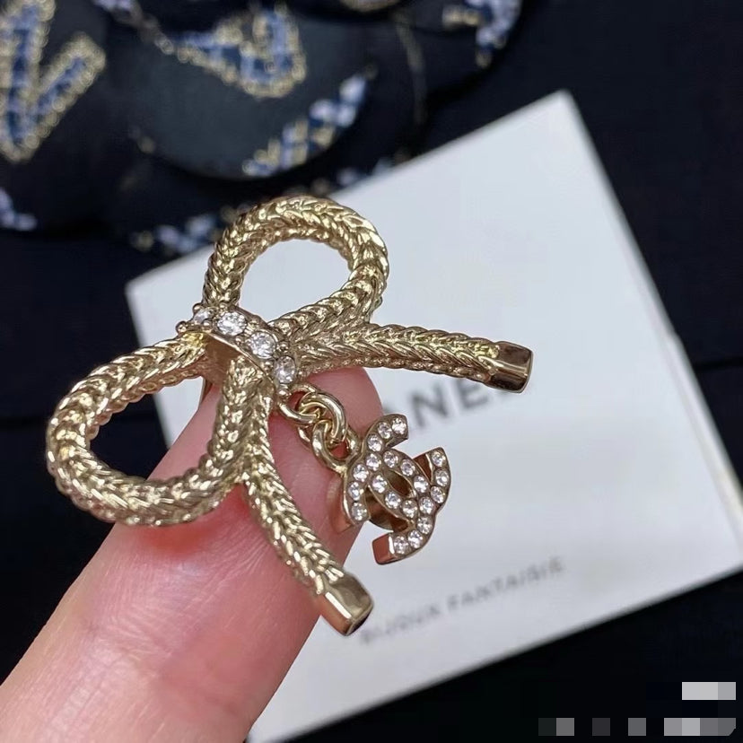 Double-C Emblem Stud Earrings in Polished Metal-Tone – Design 383 styled product view
