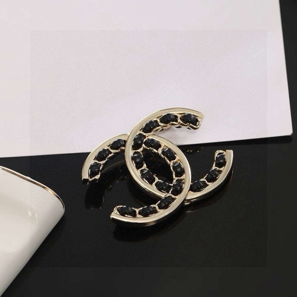 Double-C Emblem Brooch in Polished Metal-Tone – Black Detail – Design 002 main product view