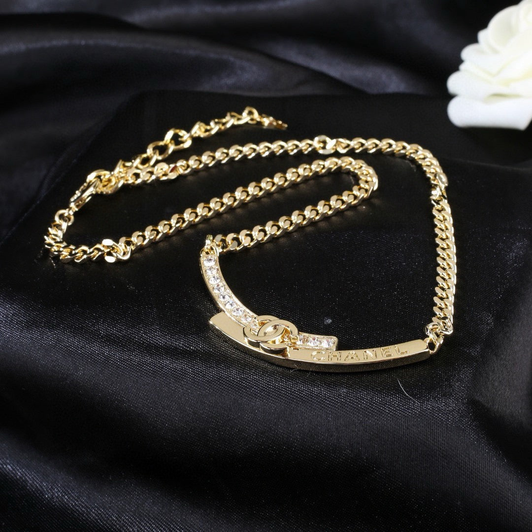 Double-C Emblem Pendant Necklace in Polished Metal-Tone – White Detail side detail