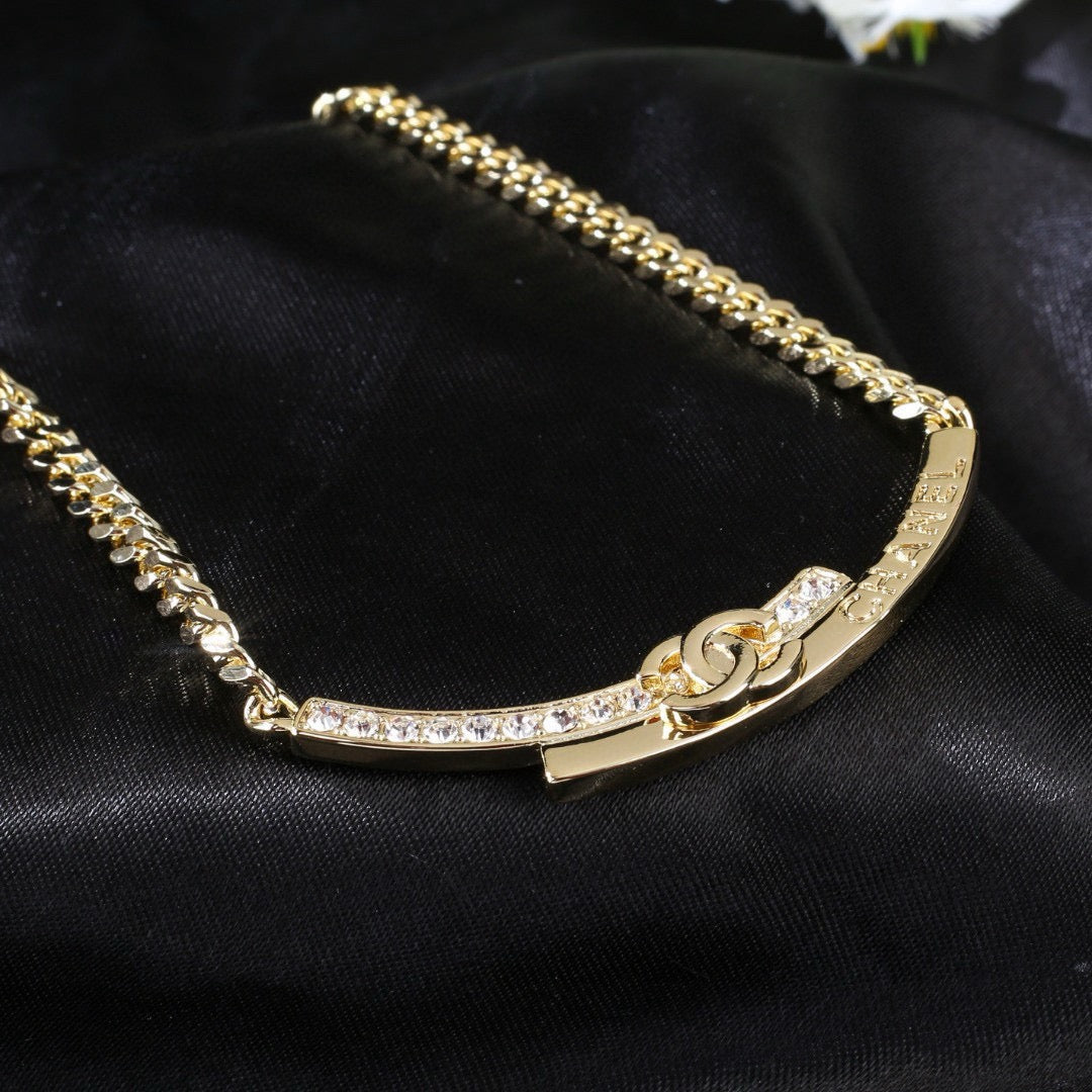 Double-C Emblem Pendant Necklace in Polished Metal-Tone – White Detail close-up detail