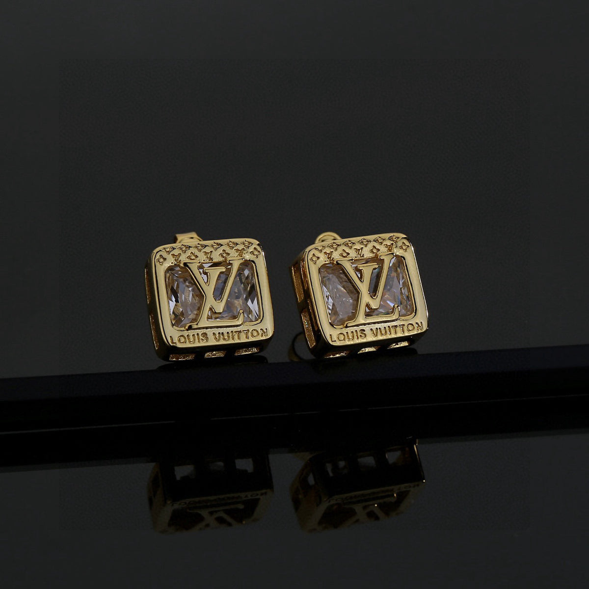 Martin Graham stud earrings in polished metal-tone – front product view