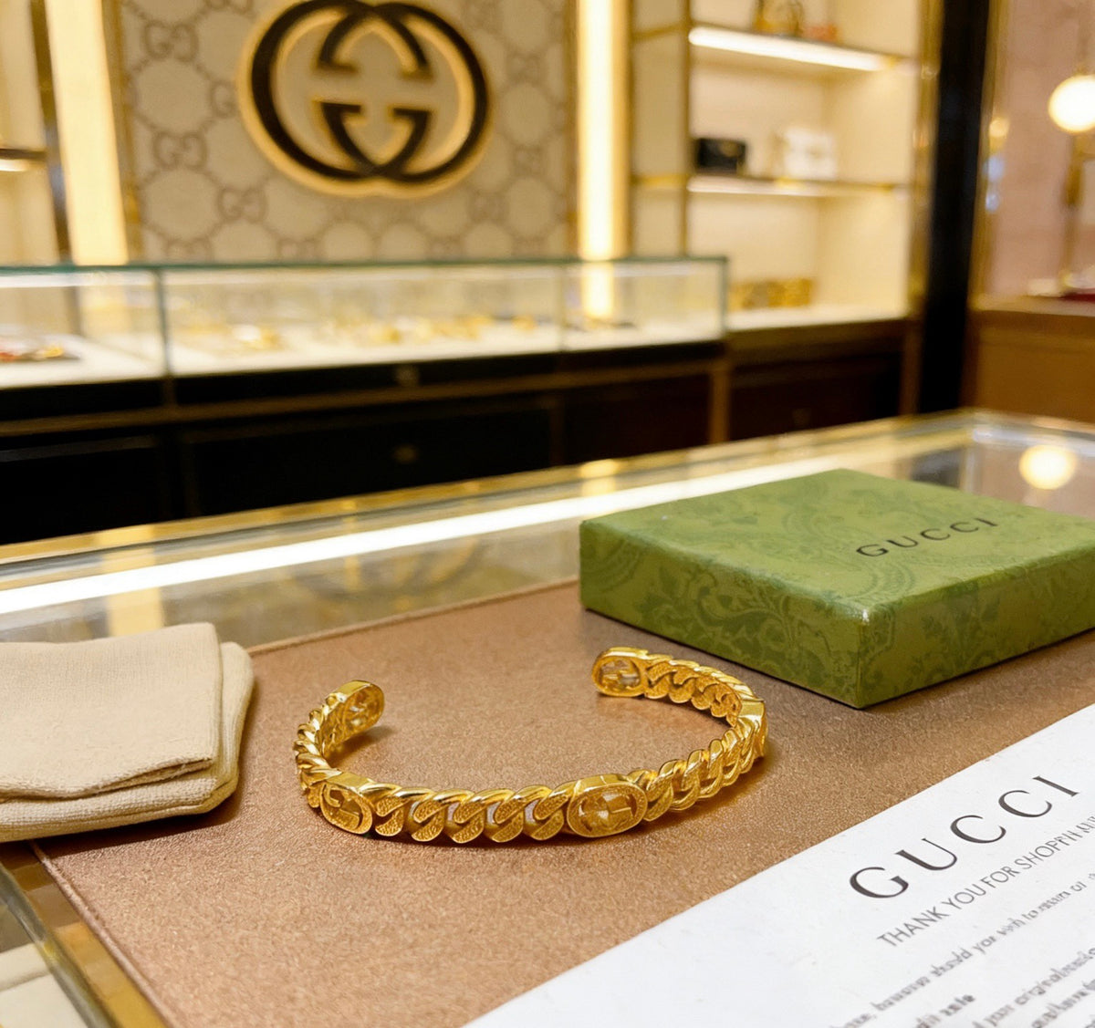 Double-G Emblem Bangle in Rose-Gold-Tone close-up detail