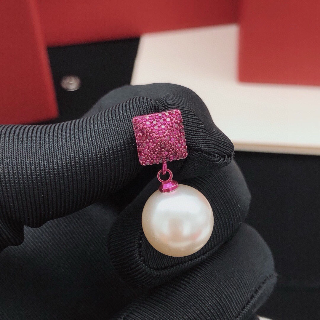 Triangle Pearl-Detail Stud Earrings close-up view