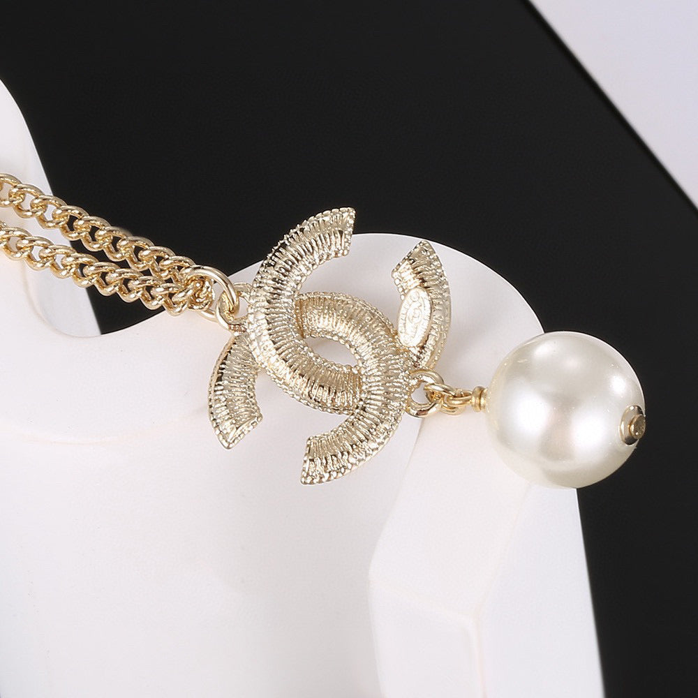 Double-C Emblem Pearl-Detail Pendant Necklace – Pearl Detail – Design 027 styled product view