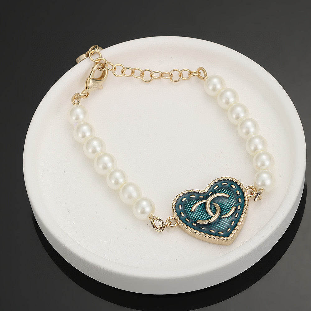 Double-C Emblem Bracelet in Polished Metal-Tone – Pearl Detail – Design 003 front product view
