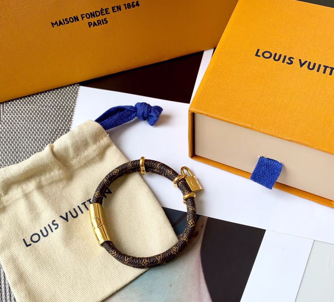 Letter Emblem Bangle in Polished Metal-Tone – Leather Detail – Design 002 close-up detail
