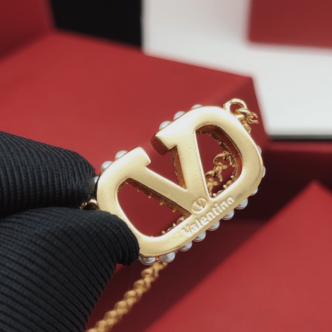 Signature Emblem Pendant Necklace in Gold-Tone – Design 12 close-up view