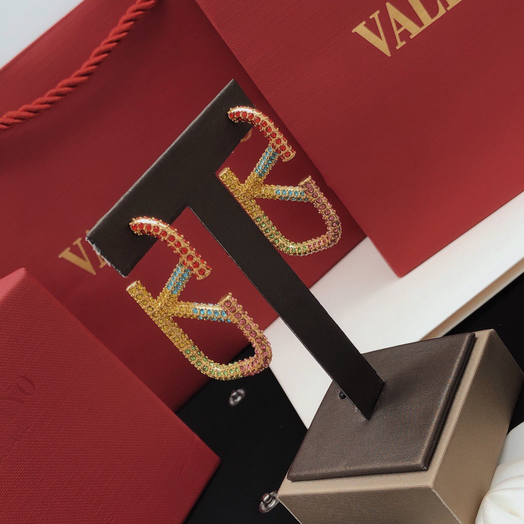 V Emblem Crystal-Accent Statement Earrings – Design 01 styled detail