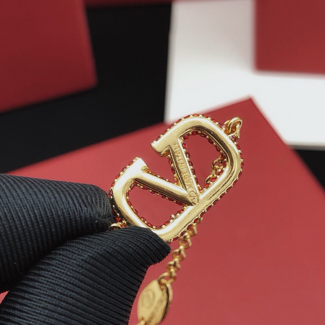 Signature Emblem Jewelry Accessory – Red styled detail
