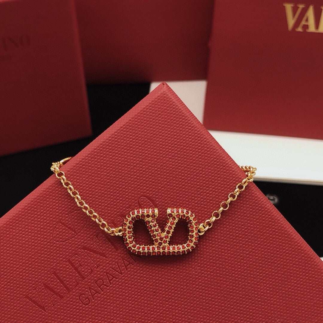 Signature Emblem Jewelry Accessory – Red front view