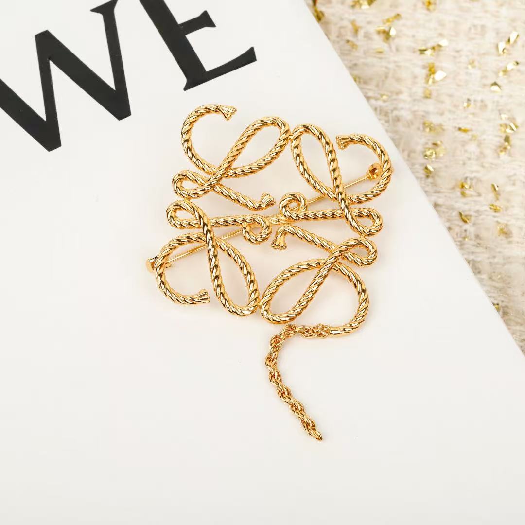 Signature Emblem Brooch in Polished Metal-Tone – Design 014 close-up detail