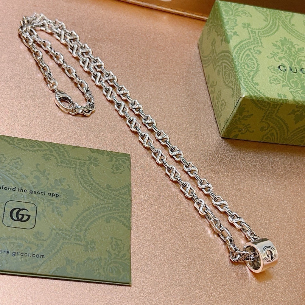 Double-G Emblem Pendant Necklace in Polished Metal-Tone – Vintage Detail – Design 025 close-up detail