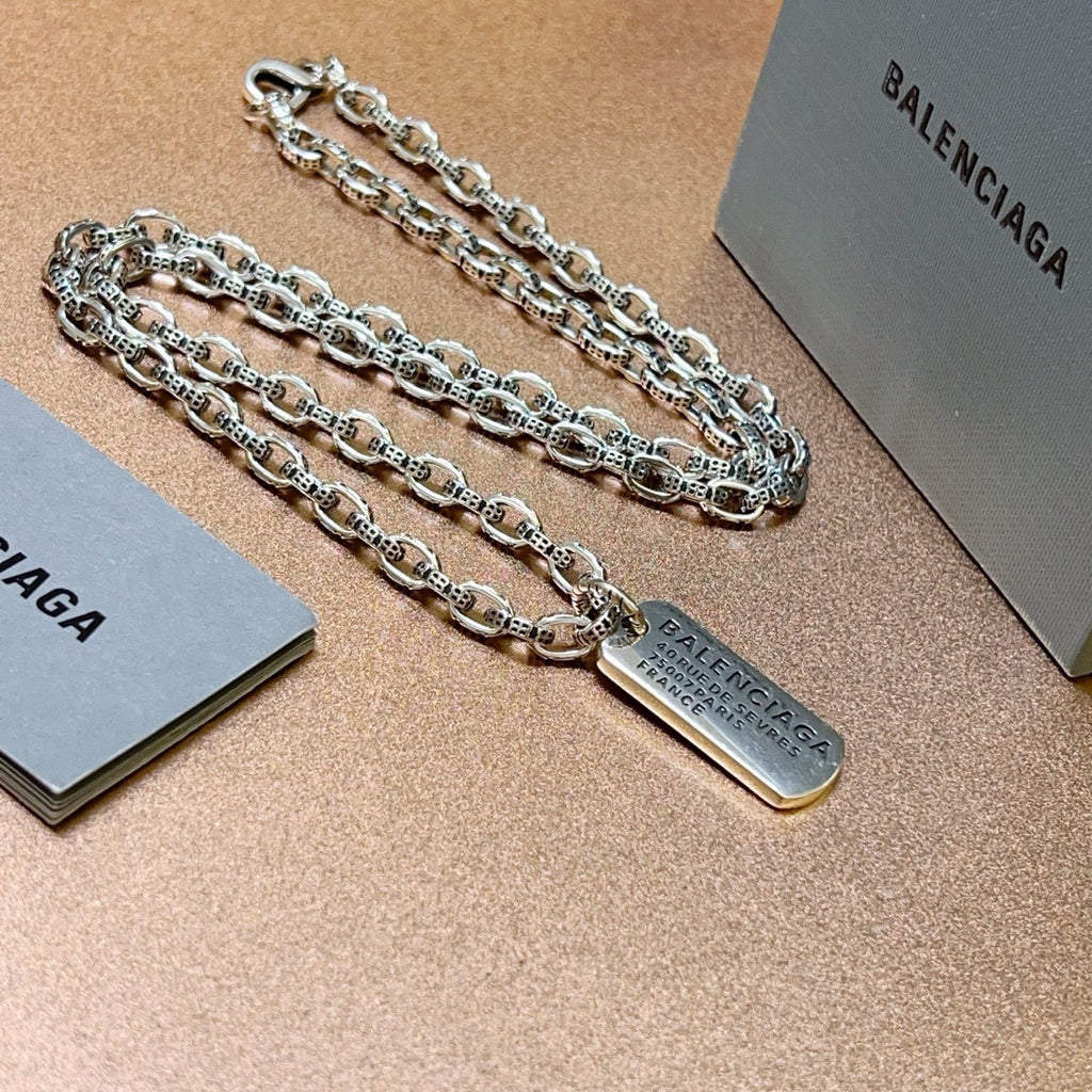 Martin Graham pendant necklace in polished metal-tone – close-up detail