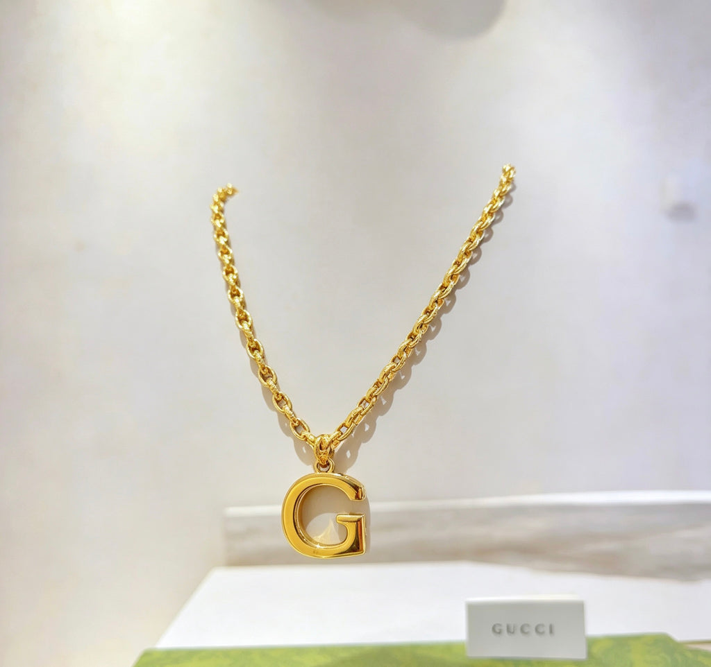 Double-G Emblem Pendant Necklace in Gold-Tone – Design 010 close-up detail