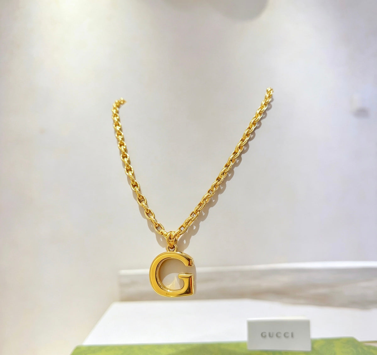 Double-G Emblem Pendant Necklace in Gold-Tone – Design 010 close-up detail
