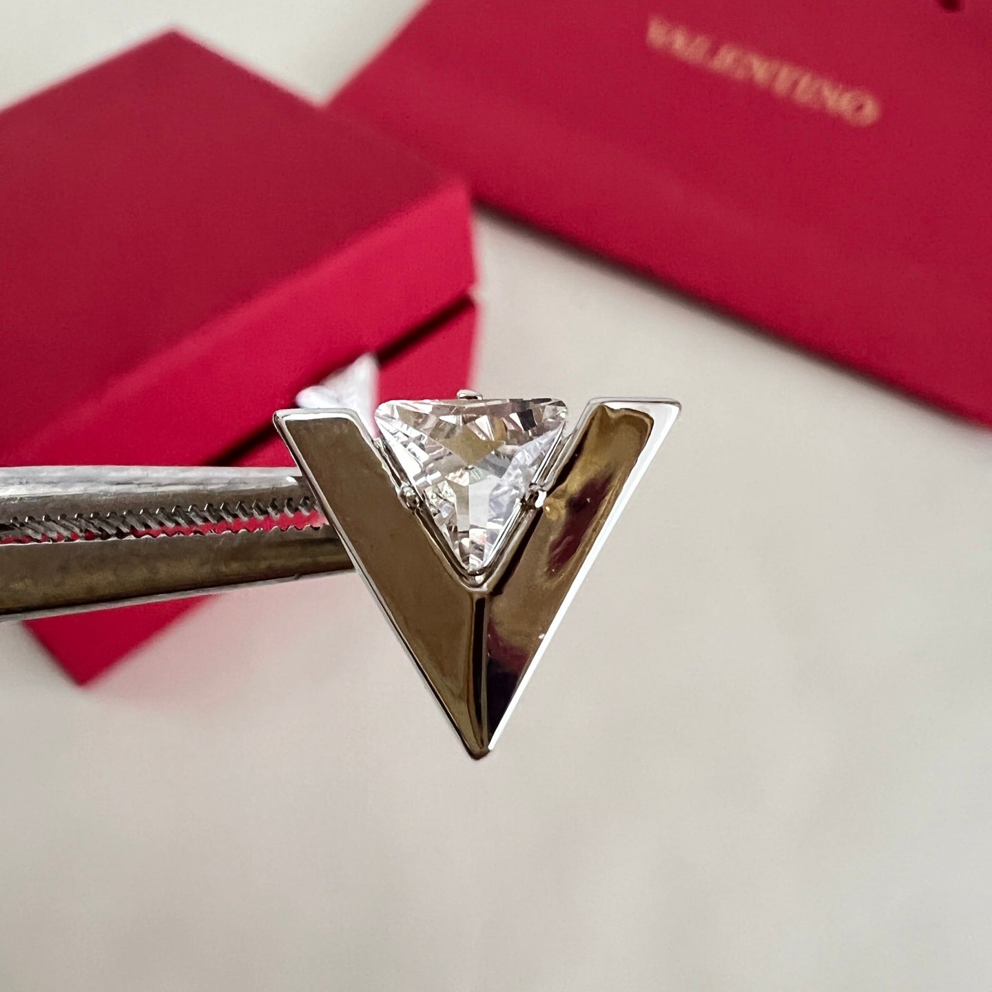 Signature Emblem Stud Earrings in Polished Metal-Tone – Design 02 close-up view
