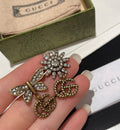 Double-G Emblem Stud Earrings in Polished Metal-Tone – Design 006 main product view