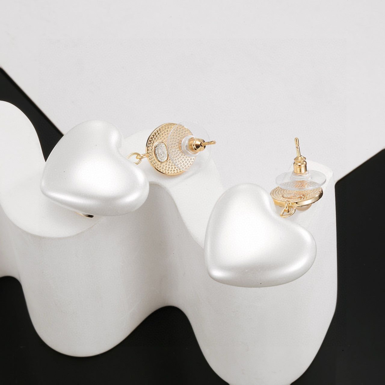 Signature Emblem Stud Earrings in Polished Metal-Tone – Design 015 detail view