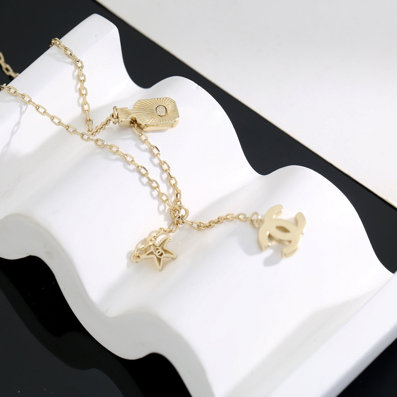 Double-C Emblem Pendant Necklace in Polished Metal-Tone – Design 009 front product view
