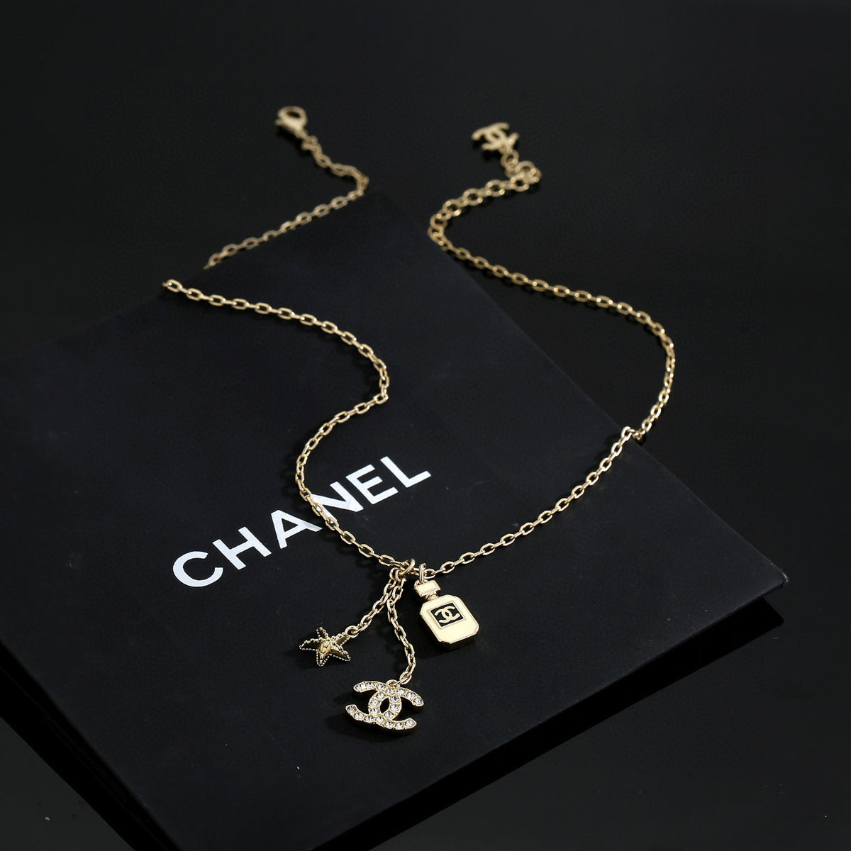 Double-C Emblem Pendant Necklace in Polished Metal-Tone – Design 009 detail view