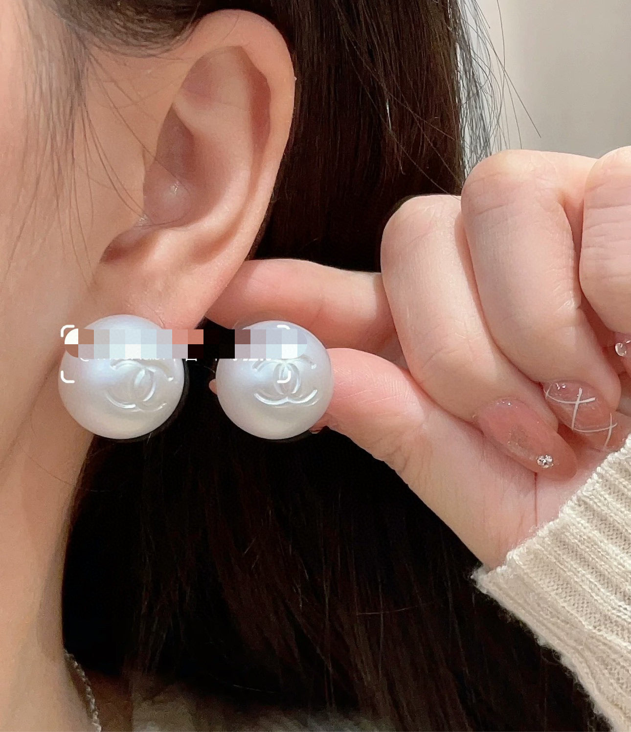 Double-C Emblem Stud Earrings in Polished Metal-Tone – White Detail – Design 002 styled product view