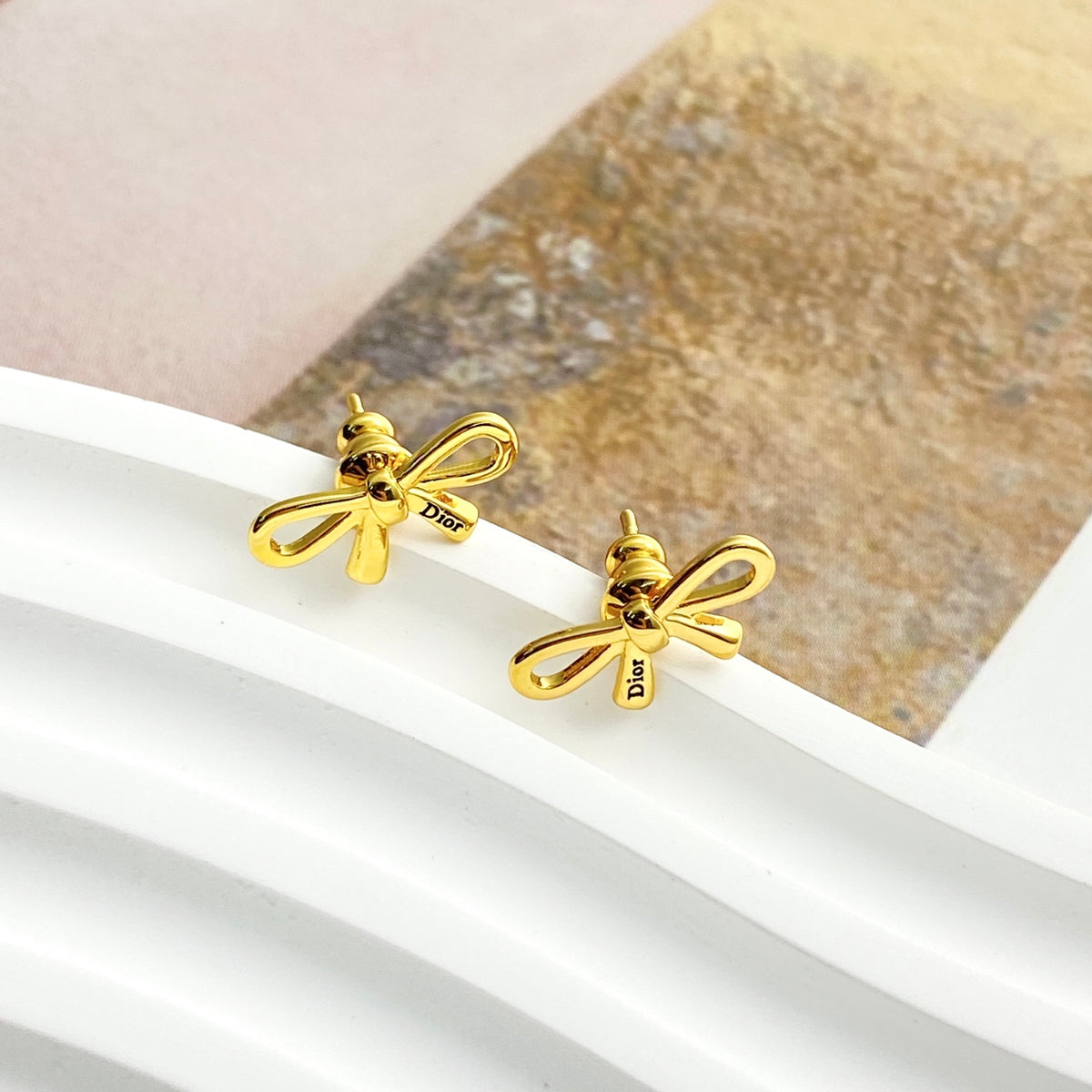 Bow & Butterfly Motif Stud Earrings in Gold-Tone with Openwork Detail main product view