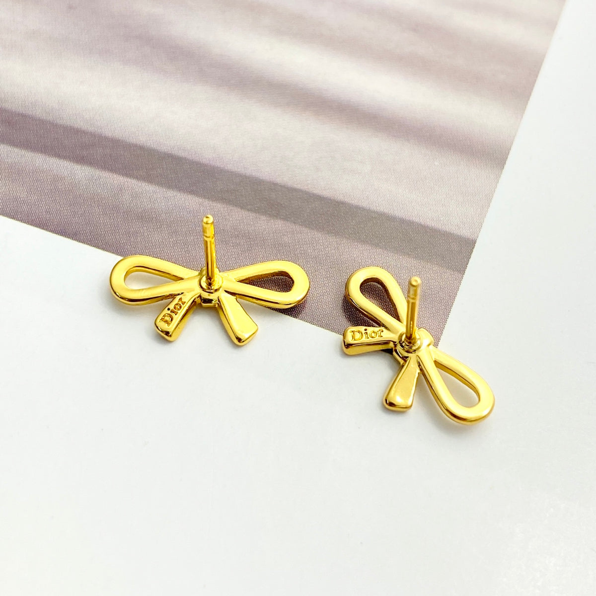 Bow & Butterfly Motif Stud Earrings in Gold-Tone with Openwork Detail front view
