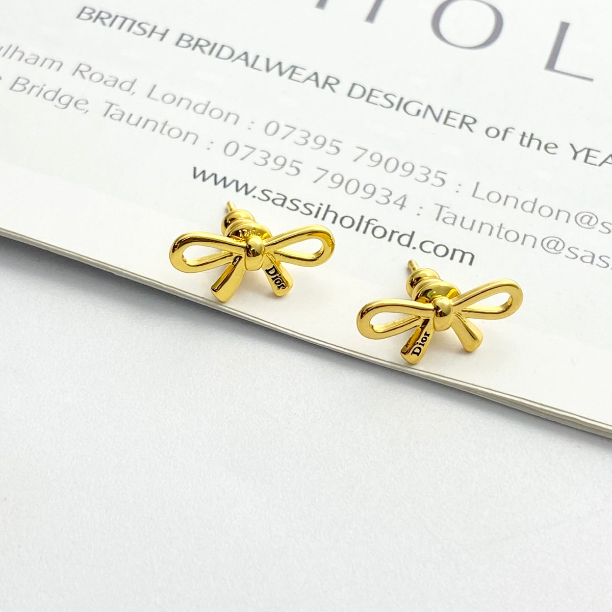 Bow & Butterfly Motif Stud Earrings in Gold-Tone with Openwork Detail detail view
