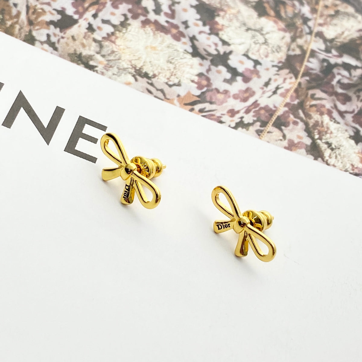 Bow & Butterfly Motif Stud Earrings in Gold-Tone with Openwork Detail front view