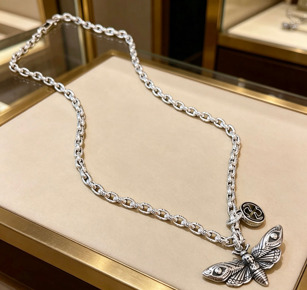 Double-G Emblem Pendant Necklace in Polished Metal-Tone – Design 054 close-up detail