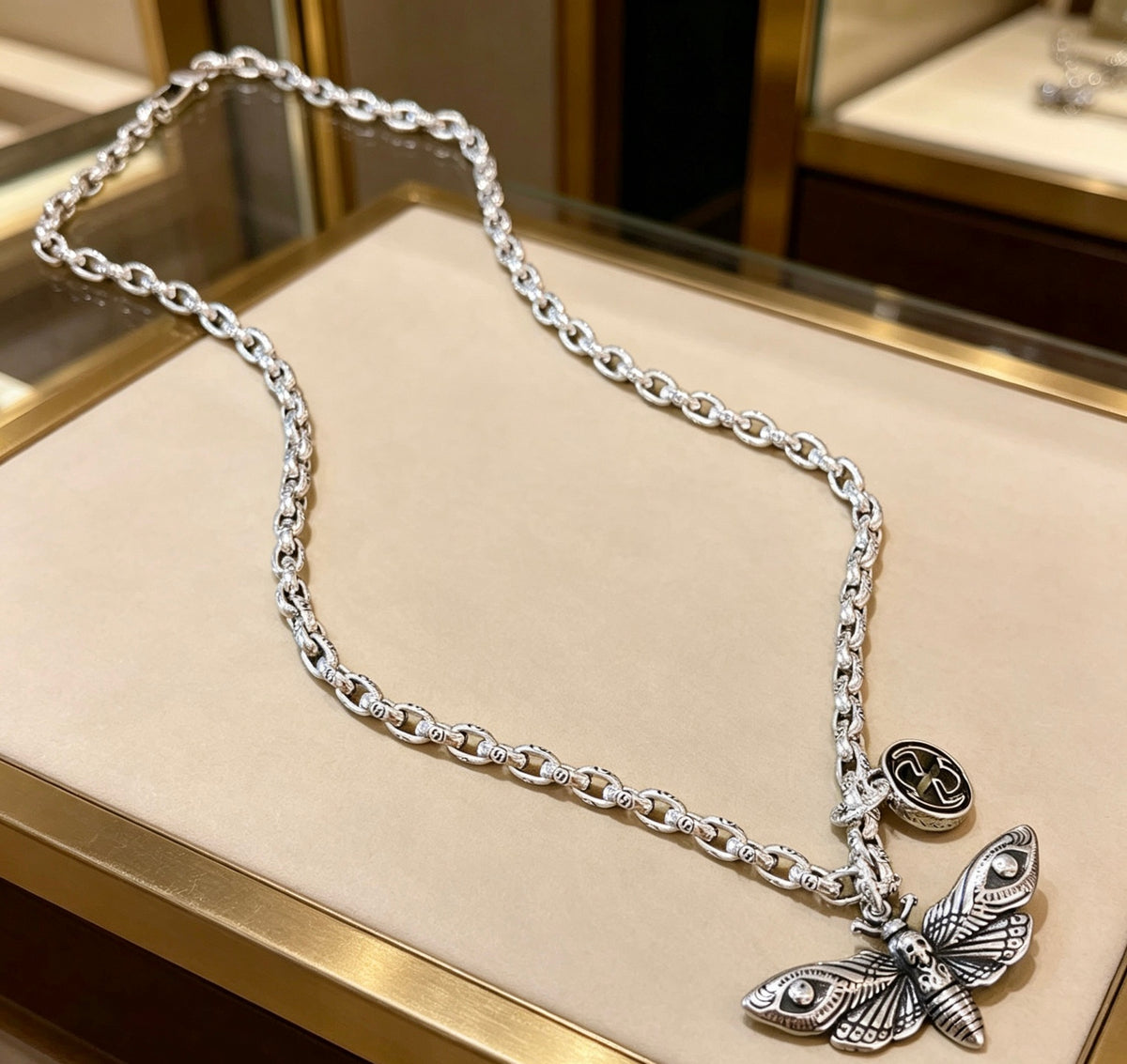 Double-G Emblem Pendant Necklace in Polished Metal-Tone – Design 054 close-up detail