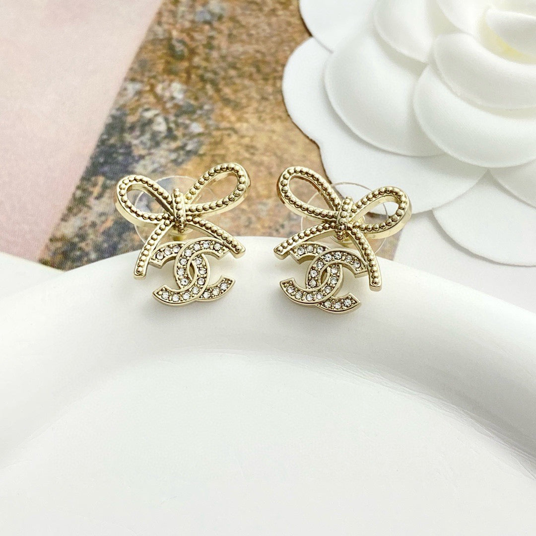 Double-C Emblem Stud Earrings in Polished Metal-Tone – Design 127 styled product view