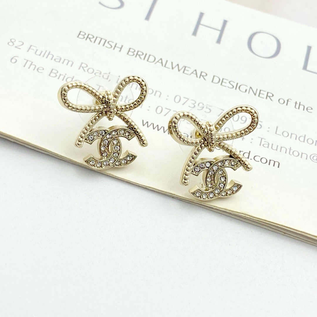 Double-C Emblem Stud Earrings in Polished Metal-Tone – Design 127 close-up detail