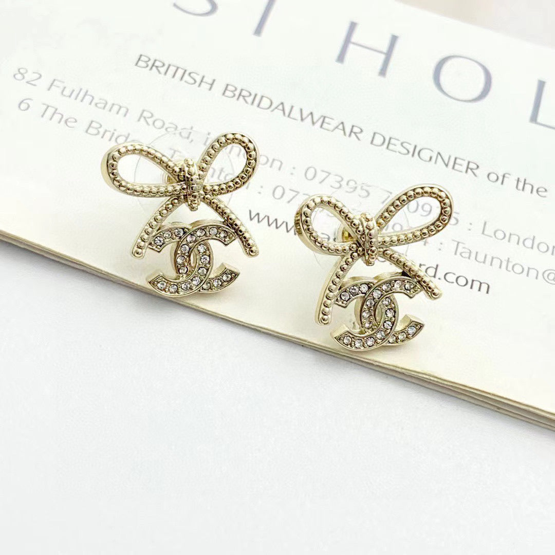 Double-C Emblem Stud Earrings in Polished Metal-Tone – Design 115 front product view