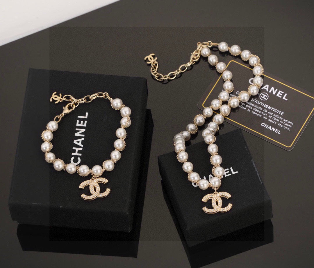 Double-C Emblem Bracelet in Polished Metal-Tone – Pearl Detail main product view
