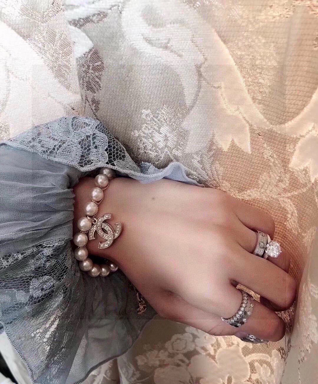 Double-C Emblem Bracelet in Polished Metal-Tone – Pearl Detail detail view