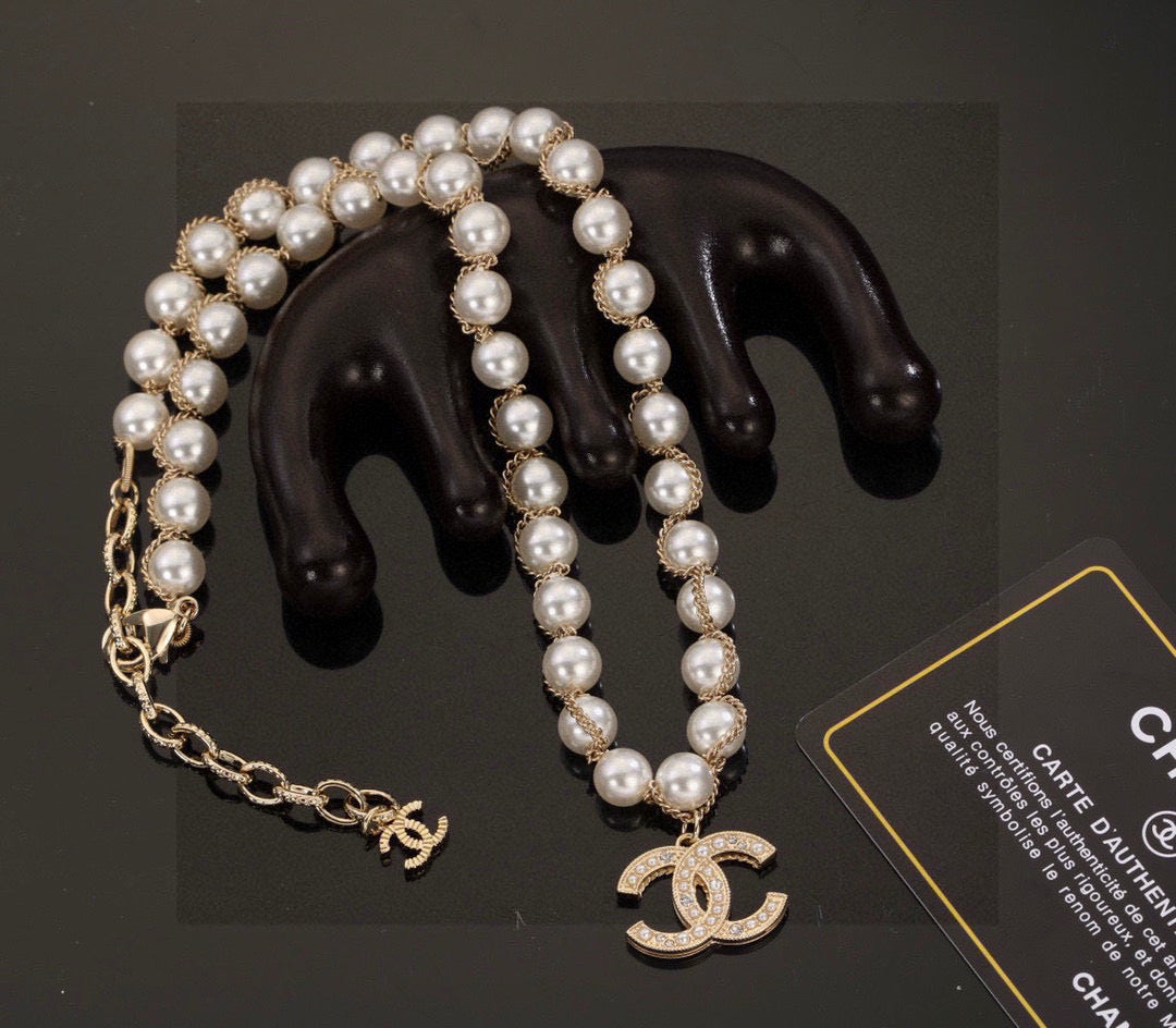 Double-C Emblem Bracelet in Polished Metal-Tone – Pearl Detail main product view