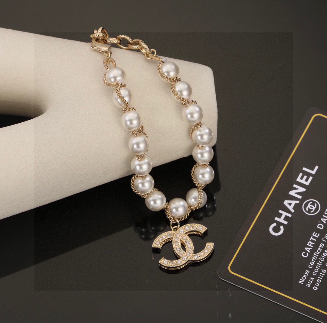 Double-C Emblem Bracelet in Polished Metal-Tone – Pearl Detail – Design 002 styled product view