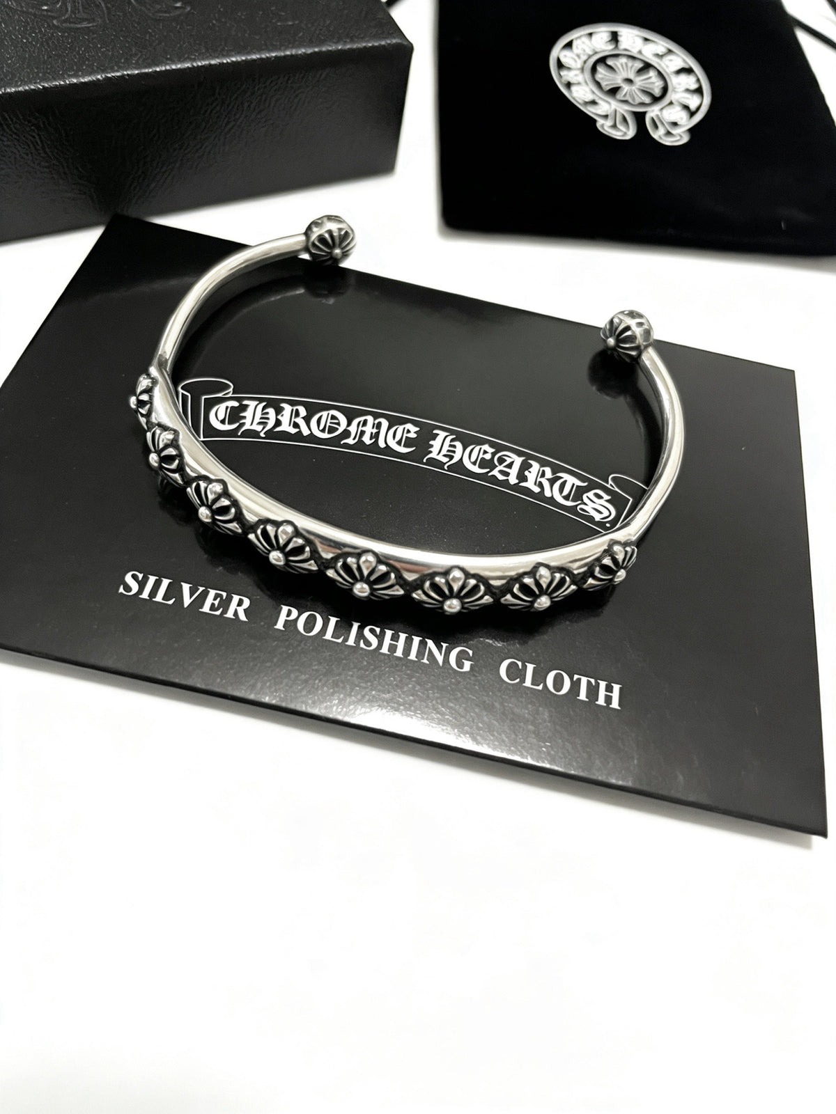 Signature Emblem Bangle in Polished Metal-Tone – Design 007 detail view
