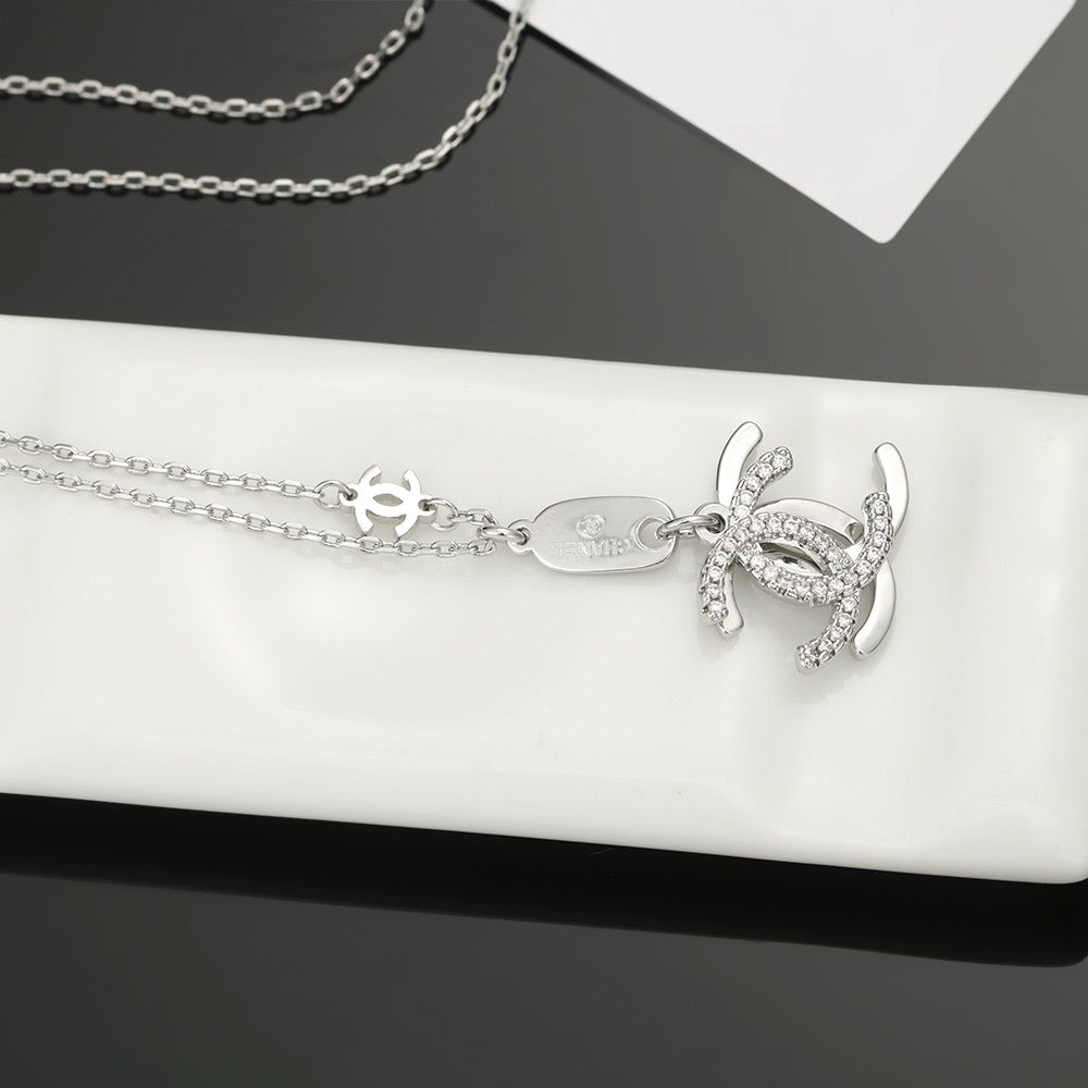 Double-C Emblem Pendant Necklace in Polished Metal-Tone – Design 002 close-up detail