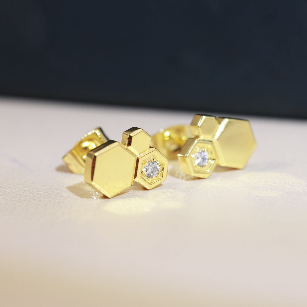 Signature Emblem Stud Earrings in Polished Metal-Tone – Design 001 detail view